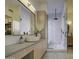 Modern bathroom featuring a vessel sink, vanity, and glass-enclosed shower at 14132 W Bent Tree S Cir, Litchfield Park, AZ 85340