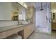 Modern bathroom with a floating vanity, vessel sink, and glass shower at 14132 W Bent Tree S Cir, Litchfield Park, AZ 85340