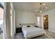 Bedroom with natural light from windows and access to the outdoor patio at 14132 W Bent Tree S Cir, Litchfield Park, AZ 85340