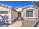 Beautifully landscaped home with a well-maintained walkway leading to the front door at 14132 W Bent Tree S Cir, Litchfield Park, AZ 85340