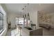 Bright, modern kitchen with an island cooktop, undermount sink, and access to the outdoor patio at 14132 W Bent Tree S Cir, Litchfield Park, AZ 85340