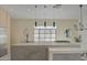 Modern kitchen boasts an expansive island, sleek countertops, and pendant lighting at 14132 W Bent Tree S Cir, Litchfield Park, AZ 85340
