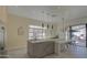 Bright kitchen featuring island, modern lighting, and stainless steel appliances at 14132 W Bent Tree S Cir, Litchfield Park, AZ 85340