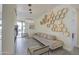 Comfortable living room with stylish honeycomb wall decor and a cozy seating area with modern lighting at 14132 W Bent Tree S Cir, Litchfield Park, AZ 85340