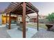 Inviting backyard with a pergola featuring a bar, swing, and landscaped yard at 16336 N 168Th Ave, Surprise, AZ 85388