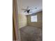 Bedroom featuring a ceiling fan, neutral walls, carpet floors, and a window at 16336 N 168Th Ave, Surprise, AZ 85388