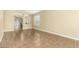 An empty living room showcases neutral tones and tile flooring, creating a bright and welcoming space at 16336 N 168Th Ave, Surprise, AZ 85388