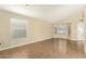 Bright living room featuring high ceilings, large windows, and neutral colors at 16336 N 168Th Ave, Surprise, AZ 85388