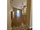 Spacious living room featuring vaulted ceilings, ceiling fans, and sliding glass doors to the backyard at 16336 N 168Th Ave, Surprise, AZ 85388