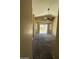 Open living room with high ceilings, a ceiling fan, and access to the backyard at 16336 N 168Th Ave, Surprise, AZ 85388