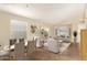 This living room has neutral paint, large windows and a dining area next to the living space at 16336 N 168Th Ave, Surprise, AZ 85388
