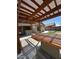 This covered patio is equipped with built-in counter and bar seating for outdoor entertaining at 16336 N 168Th Ave, Surprise, AZ 85388
