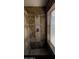 Walk-in shower featuring decorative tile, chrome fixtures, and built-in niche at 16336 N 168Th Ave, Surprise, AZ 85388