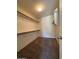 This is a walk-in closet with shelving and carpeted floors at 16336 N 168Th Ave, Surprise, AZ 85388