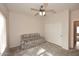 Bedroom features neutral paint, wall to wall carpet, sleeper sofa, and large closet at 16436 W Arroyo Vista Ln, Surprise, AZ 85374