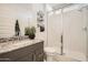 Modern bathroom featuring a vanity with granite countertops, a toilet, and a walk-in shower at 16716 W Chama Dr, Surprise, AZ 85387