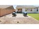 Inviting backyard with comfortable seating area, turf accents, and low-maintenance landscaping at 17816 W Oregon Ave, Litchfield Park, AZ 85340