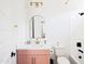 Bright bathroom featuring modern fixtures, gold hardware, and a neutral color palette at 17816 W Oregon Ave, Litchfield Park, AZ 85340