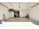 Clean, spacious garage with epoxy flooring and ample storage space for vehicles and equipment at 17816 W Oregon Ave, Litchfield Park, AZ 85340