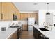 Well-appointed kitchen with stainless steel appliances, island with seating, and ample counter space for meal preparation at 17816 W Oregon Ave, Litchfield Park, AZ 85340