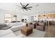 Comfortable living room featuring a ceiling fan, stylish furniture, and neutral decor at 17816 W Oregon Ave, Litchfield Park, AZ 85340
