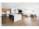 Open-concept living space featuring a kitchen island, dining area, and living room for easy entertaining and Gathering time at 17816 W Oregon Ave, Litchfield Park, AZ 85340