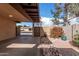 View of the carport, landscape, and the surrounding neighborhood at 1853 E Intrepid Ave, Mesa, AZ 85204