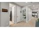 Bright hallway with wood flooring leading to bedrooms and living spaces at 18768 W Clinton St, Surprise, AZ 85388