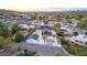 Beautiful aerial view of the modern home featuring a backyard pool and mature trees at 1955 E Greenway Rd, Phoenix, AZ 85022