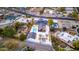 Aerial view of the modern home, highlighting the pool, landscaping, and outdoor living spaces at 1955 E Greenway Rd, Phoenix, AZ 85022