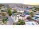 Stunning aerial view of the modern home featuring a backyard pool and spacious patio at 1955 E Greenway Rd, Phoenix, AZ 85022