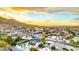 Neighborhood aerial view features mountain scenery, residential homes, and community pools under a beautiful sky at 1955 E Greenway Rd, Phoenix, AZ 85022