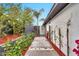 Landscaped backyard walkway with lush greenery and modern design elements at 1955 E Greenway Rd, Phoenix, AZ 85022