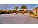 Expansive backyard featuring desert landscaping, a fire pit, and a modern gazebo at 1955 E Greenway Rd, Phoenix, AZ 85022