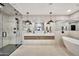 Spacious bathroom with a glass shower, dual vanity, and a modern bathtub at 1955 E Greenway Rd, Phoenix, AZ 85022