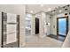 Bathroom with large shower, radiant heated towel rack, and entrance to bedroom at 1955 E Greenway Rd, Phoenix, AZ 85022