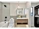 Modern bathroom featuring sleek tile, floating vanity, and advanced toilet with bidet at 1955 E Greenway Rd, Phoenix, AZ 85022