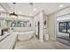 Stylish bathroom featuring a modern tub, dual vanity, and sleek fixtures at 1955 E Greenway Rd, Phoenix, AZ 85022