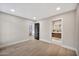 Neutral bedroom with wood floors and doors to an ensuite bath and another room at 1955 E Greenway Rd, Phoenix, AZ 85022