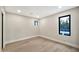 Minimalist bedroom with wood floors, white walls, and a pool view through window at 1955 E Greenway Rd, Phoenix, AZ 85022