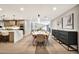 Open-concept layout with kitchen island, dining area, and modern cabinetry at 1955 E Greenway Rd, Phoenix, AZ 85022