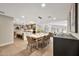 Bright open-concept floor plan with a dining area and kitchen, ideal for modern living at 1955 E Greenway Rd, Phoenix, AZ 85022
