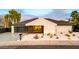 Modern home featuring a sleek design, xeriscaping, and a black garage door at 1955 E Greenway Rd, Phoenix, AZ 85022