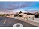Home exterior with desert landscaping and a modern architectural design at sunset at 1955 E Greenway Rd, Phoenix, AZ 85022