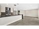 Bright kitchen with a kitchen island with seating, stainless steel appliances, and tile flooring at 1955 E Greenway Rd, Phoenix, AZ 85022