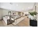 Inviting living room featuring neutral tones, modern decor, recessed lighting, and hardwood floors at 1955 E Greenway Rd, Phoenix, AZ 85022