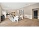 Open-concept living room with light hardwood floors, recessed lighting, and stylish decor at 1955 E Greenway Rd, Phoenix, AZ 85022