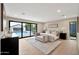 Bright main bedroom with a sitting area and backyard view at 1955 E Greenway Rd, Phoenix, AZ 85022