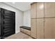 Practical mud room features built-in storage and a bench seat at 1955 E Greenway Rd, Phoenix, AZ 85022