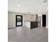 Open floor plan features a spacious living area and a modern kitchen with island seating at 1955 E Greenway Rd, Phoenix, AZ 85022